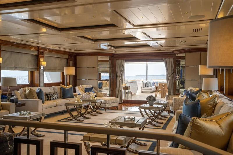 a living room with a large window aboard TACANUYA Yacht for Charter