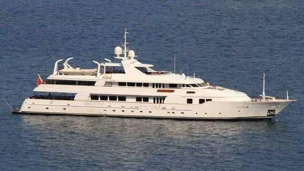 a large white boat in the water aboard TACANUYA Yacht for Charter