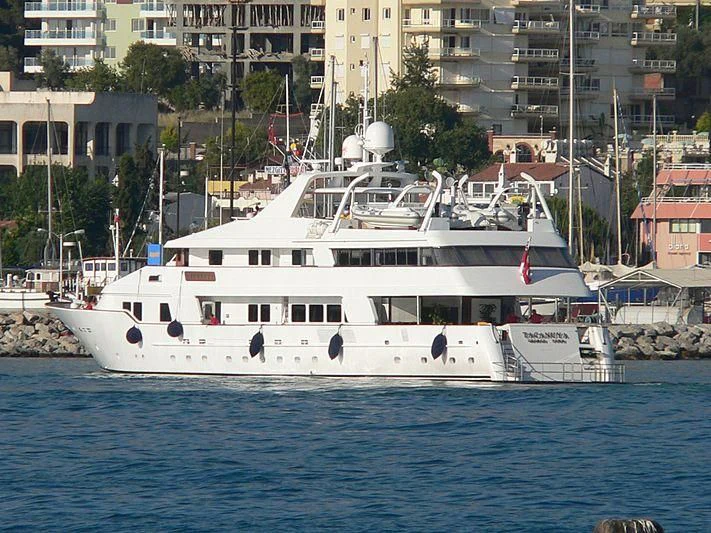 a white boat in the water aboard TACANUYA Yacht for Charter