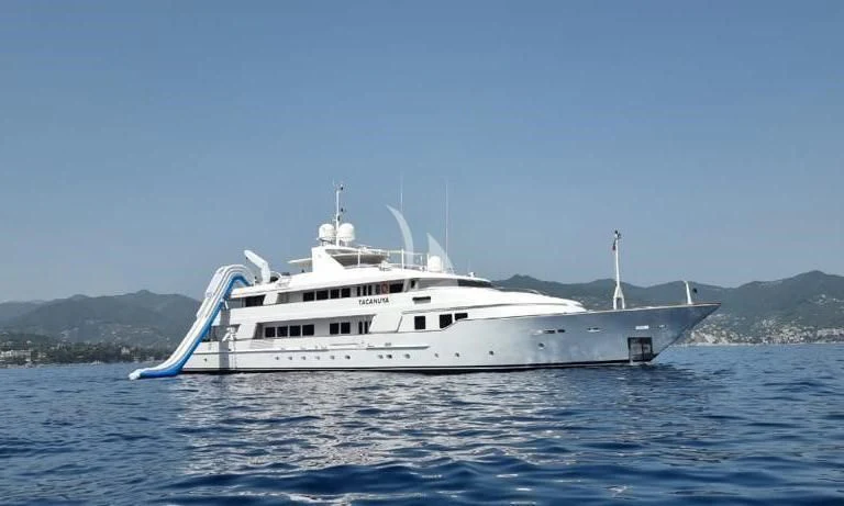 a white yacht in the water aboard TACANUYA Yacht for Charter