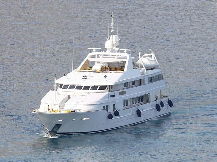 a large white boat in the water aboard TACANUYA Yacht for Charter