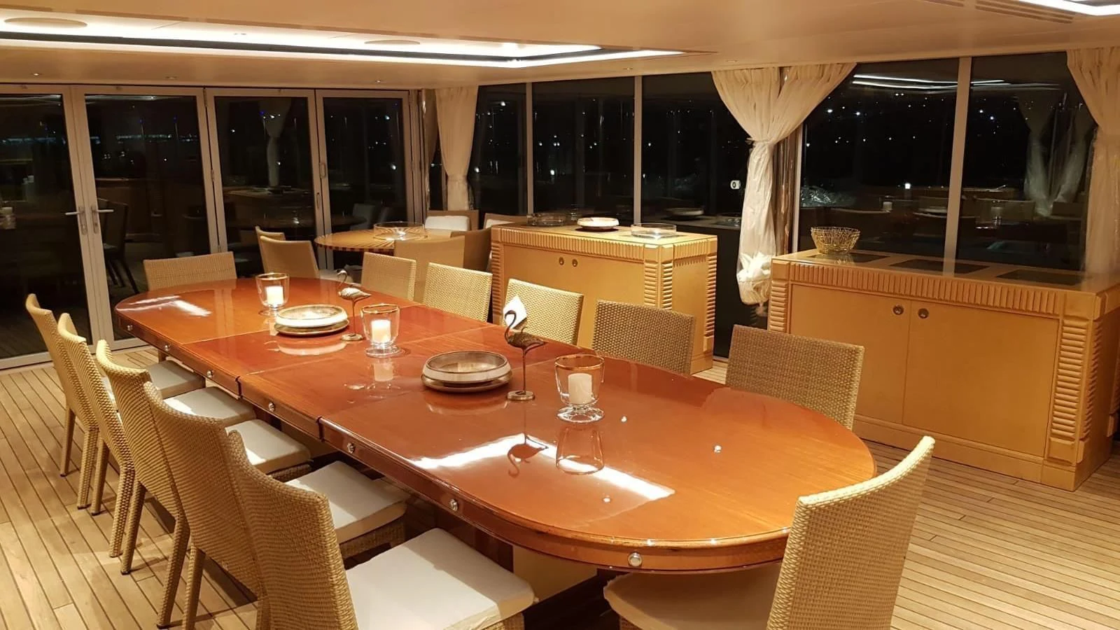 a large dining room table aboard TACANUYA Yacht for Charter