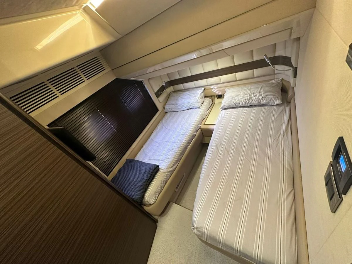 a bunk bed with a couple of beds in it aboard AZIMUT 64 FLY 2014 Yacht for Sale