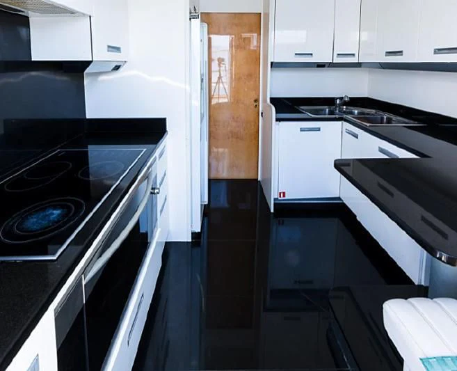 a kitchen with white cabinets aboard HERMES Yacht for Sale