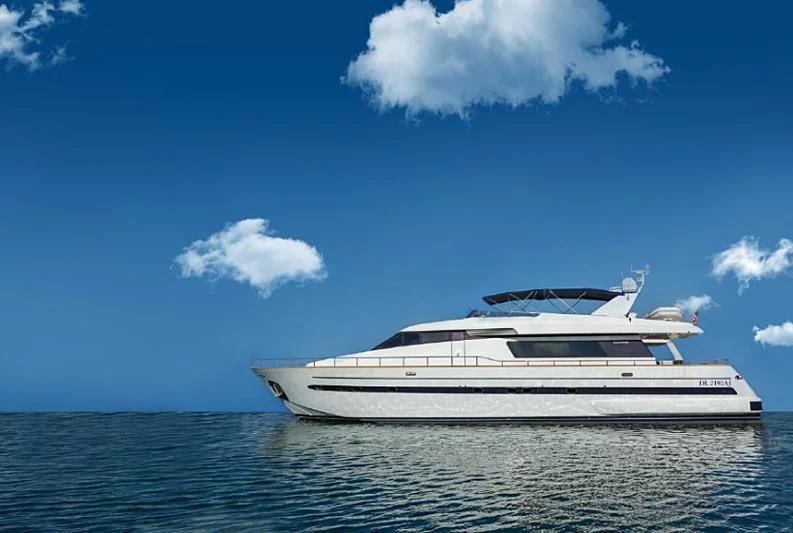 a white yacht in the water aboard HERMES Yacht for Sale