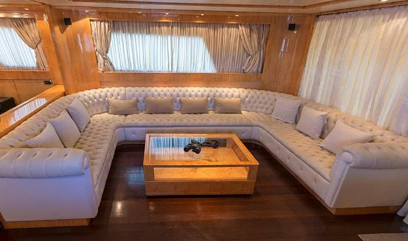 a living room with a couch and a coffee table aboard HERMES Yacht for Sale