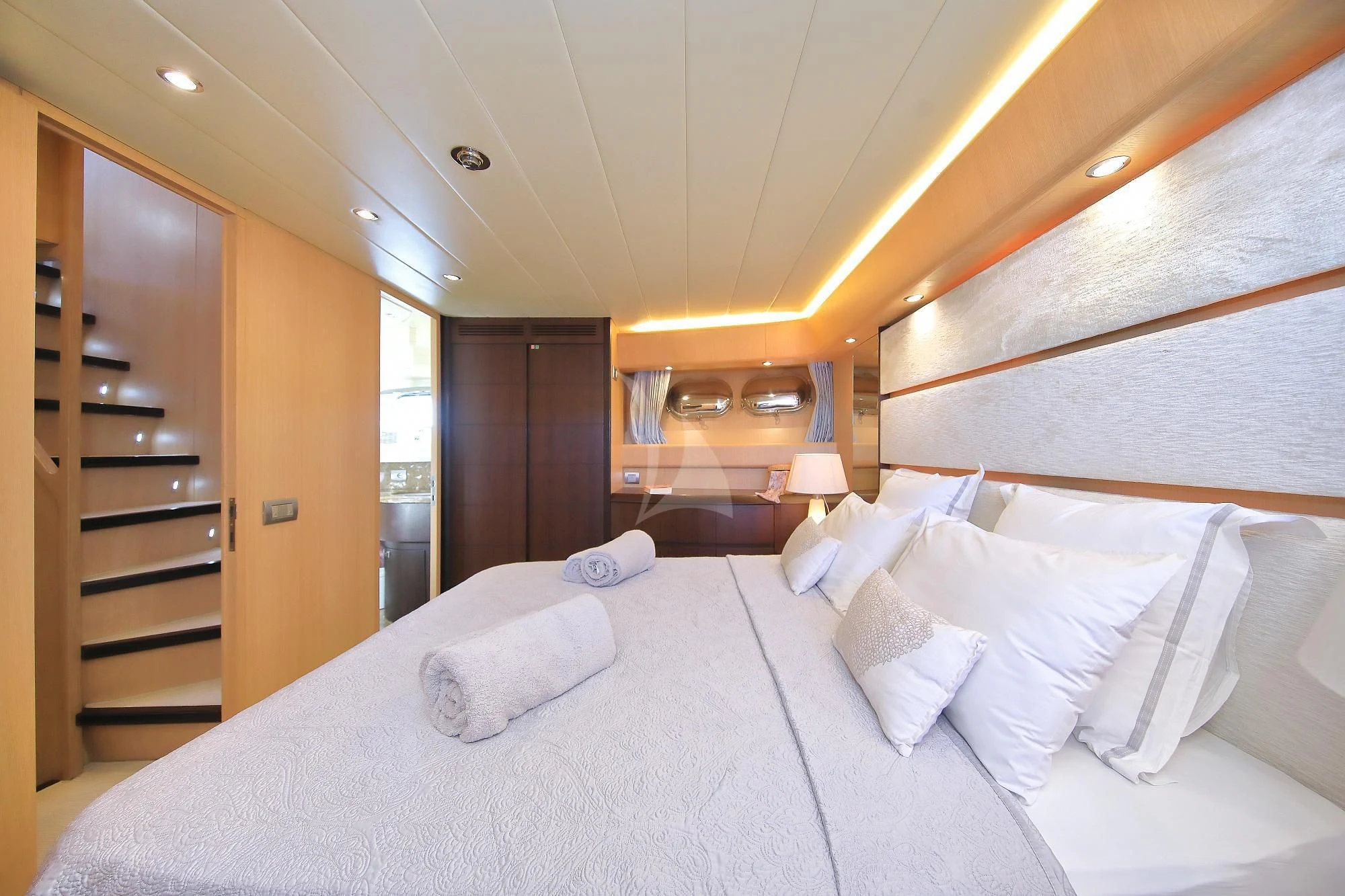 a large bed with white sheets aboard HOPE I Yacht for Charter