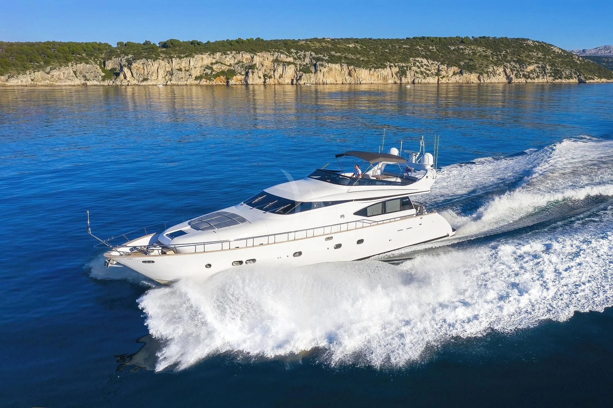 a white yacht on water aboard HOPE I Yacht for Charter
