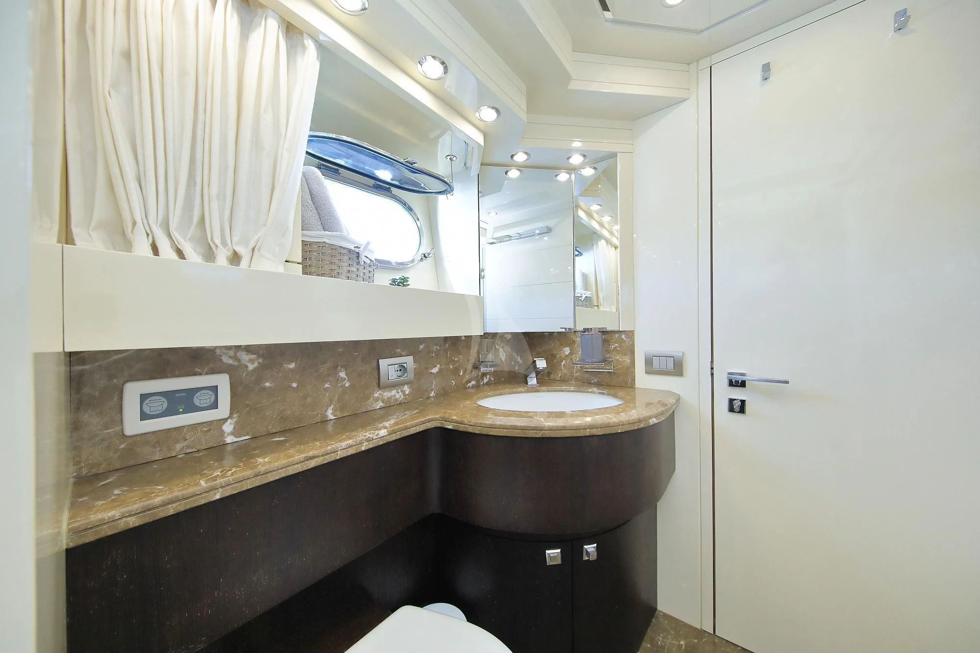 a bathroom with a sink and a mirror aboard HOPE I Yacht for Charter