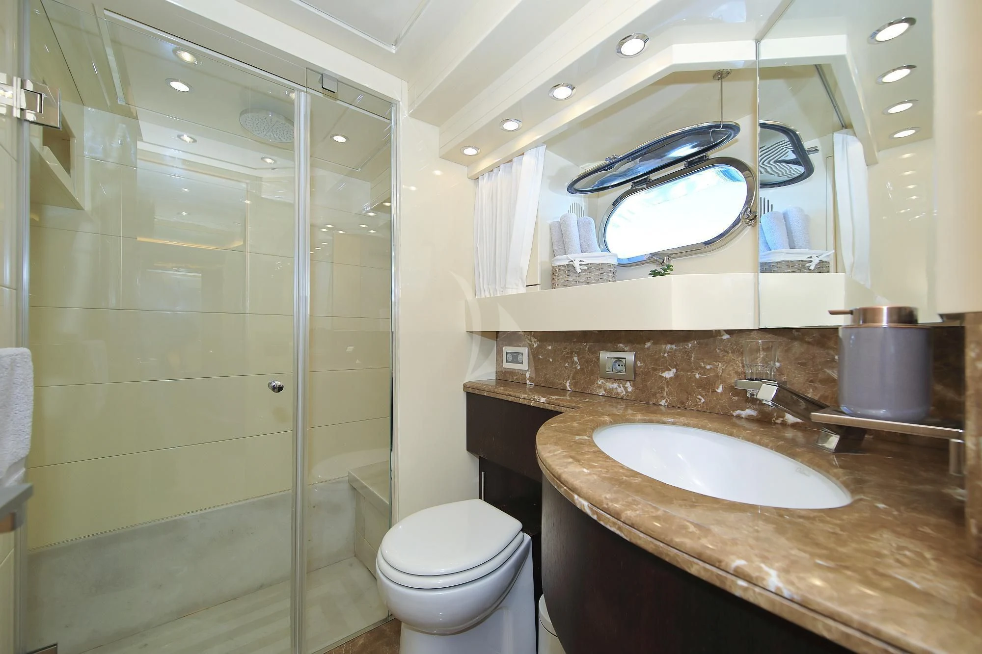 a bathroom with a glass shower door aboard HOPE I Yacht for Charter