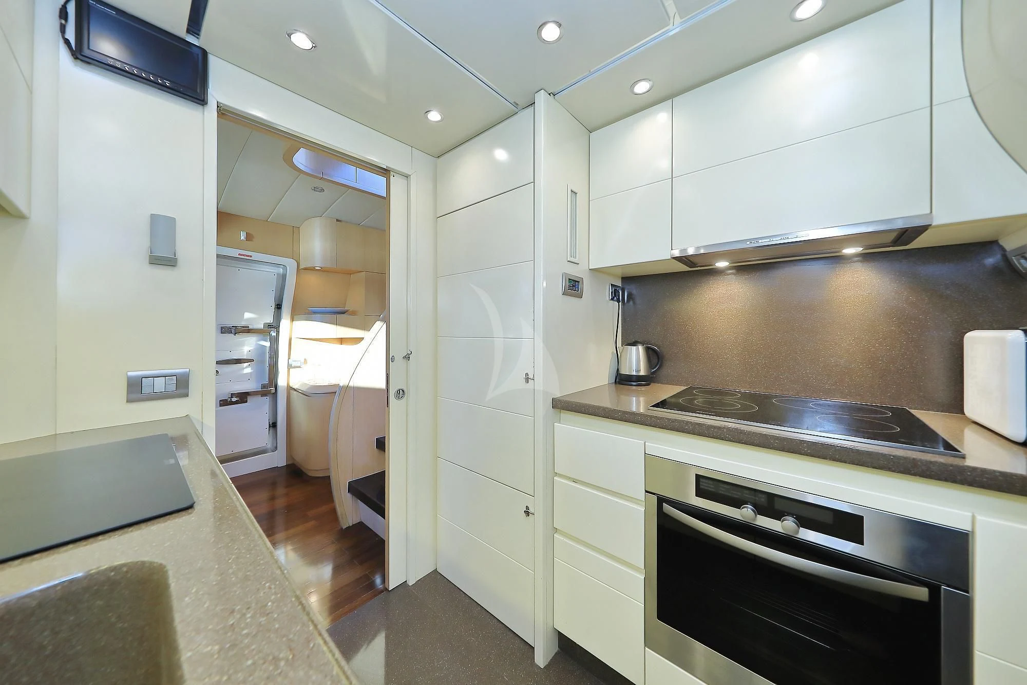 a kitchen with white cabinets aboard HOPE I Yacht for Charter