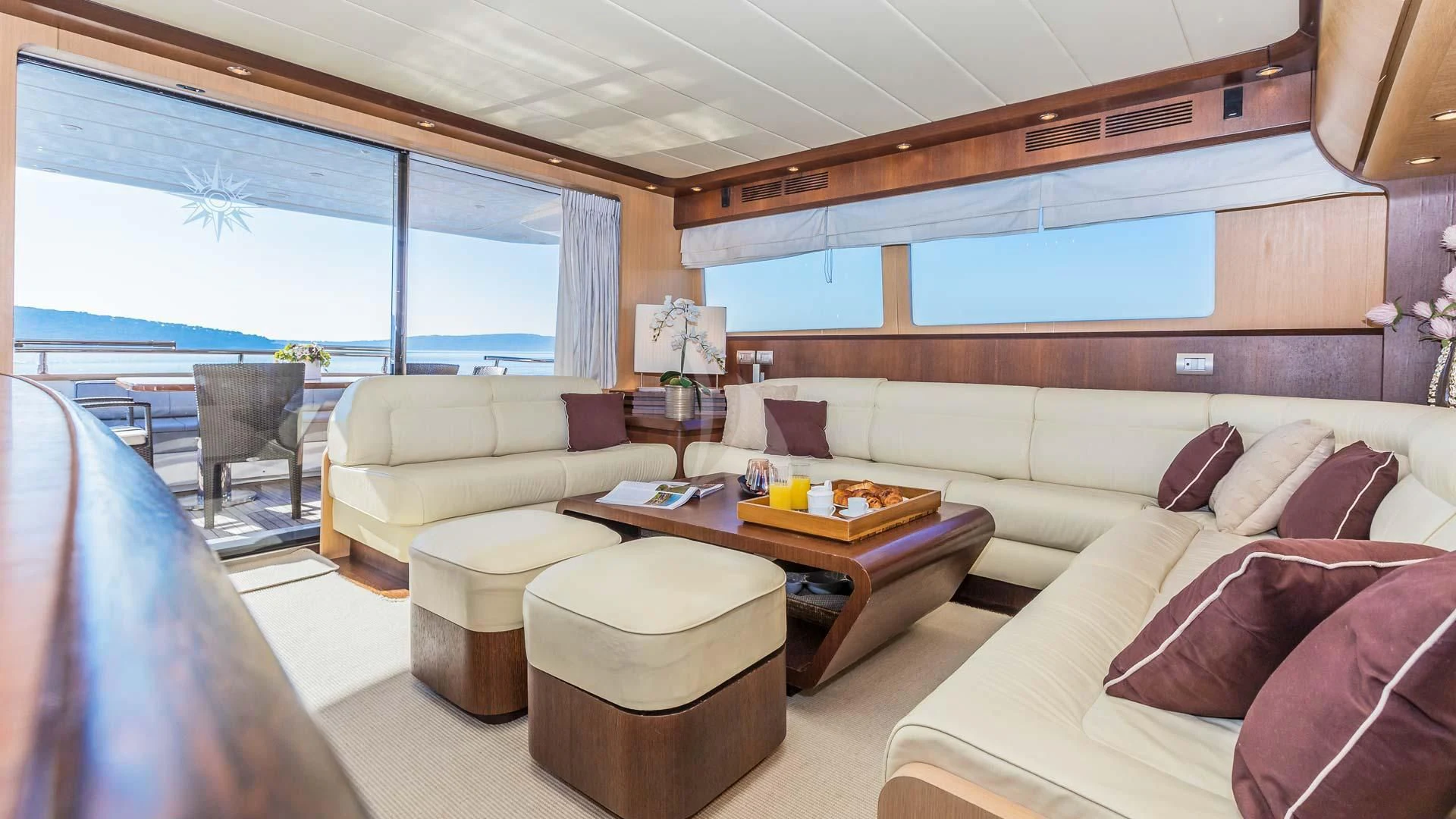 a living room with a couch and a table aboard HOPE I Yacht for Charter