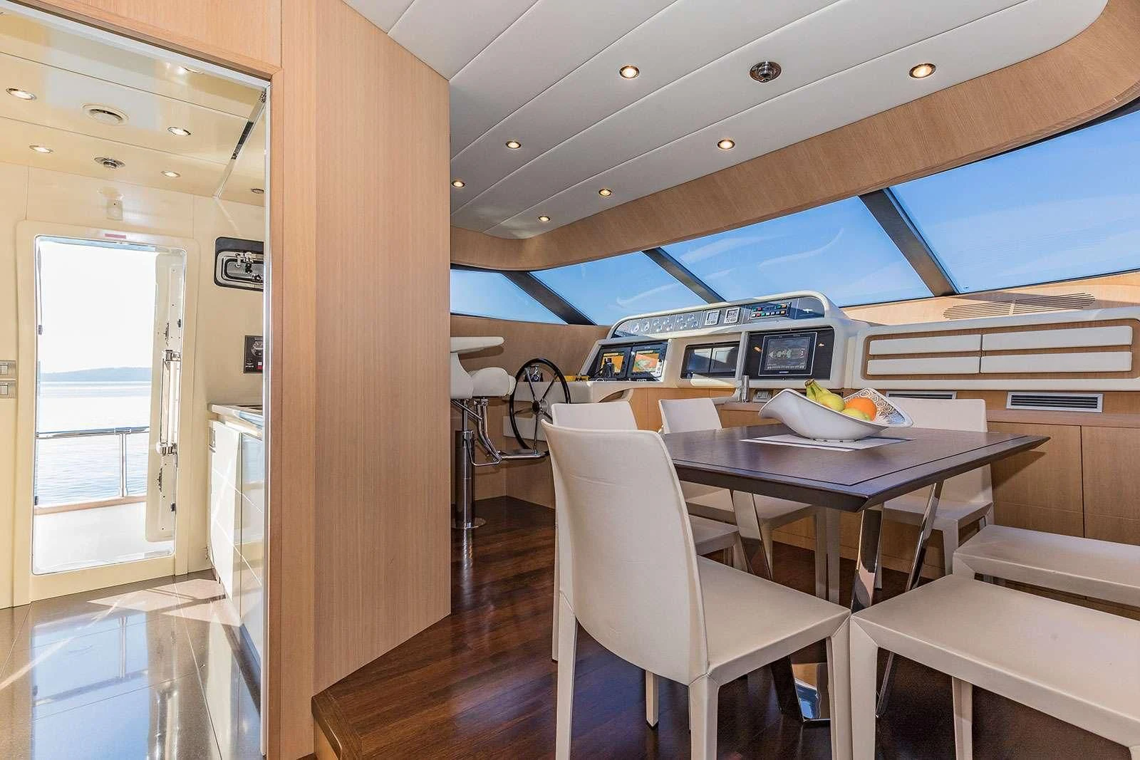 a room with a table and chairs aboard HOPE I Yacht for Charter
