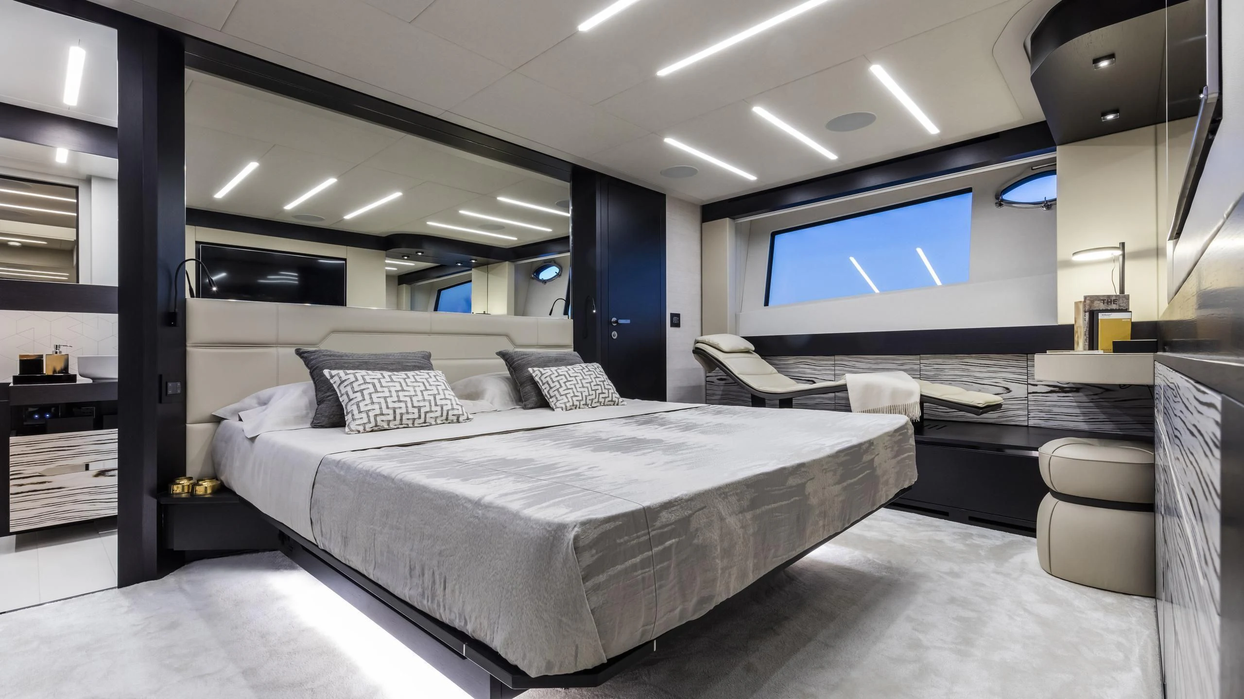 a large room with a bed and a tv aboard MIRLO BLANCO Yacht for Sale