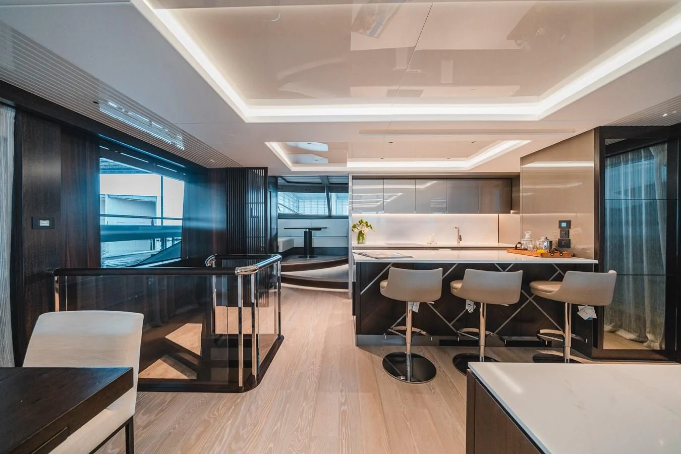 a room with tables and chairs aboard 90 OCEAN Yacht for Sale