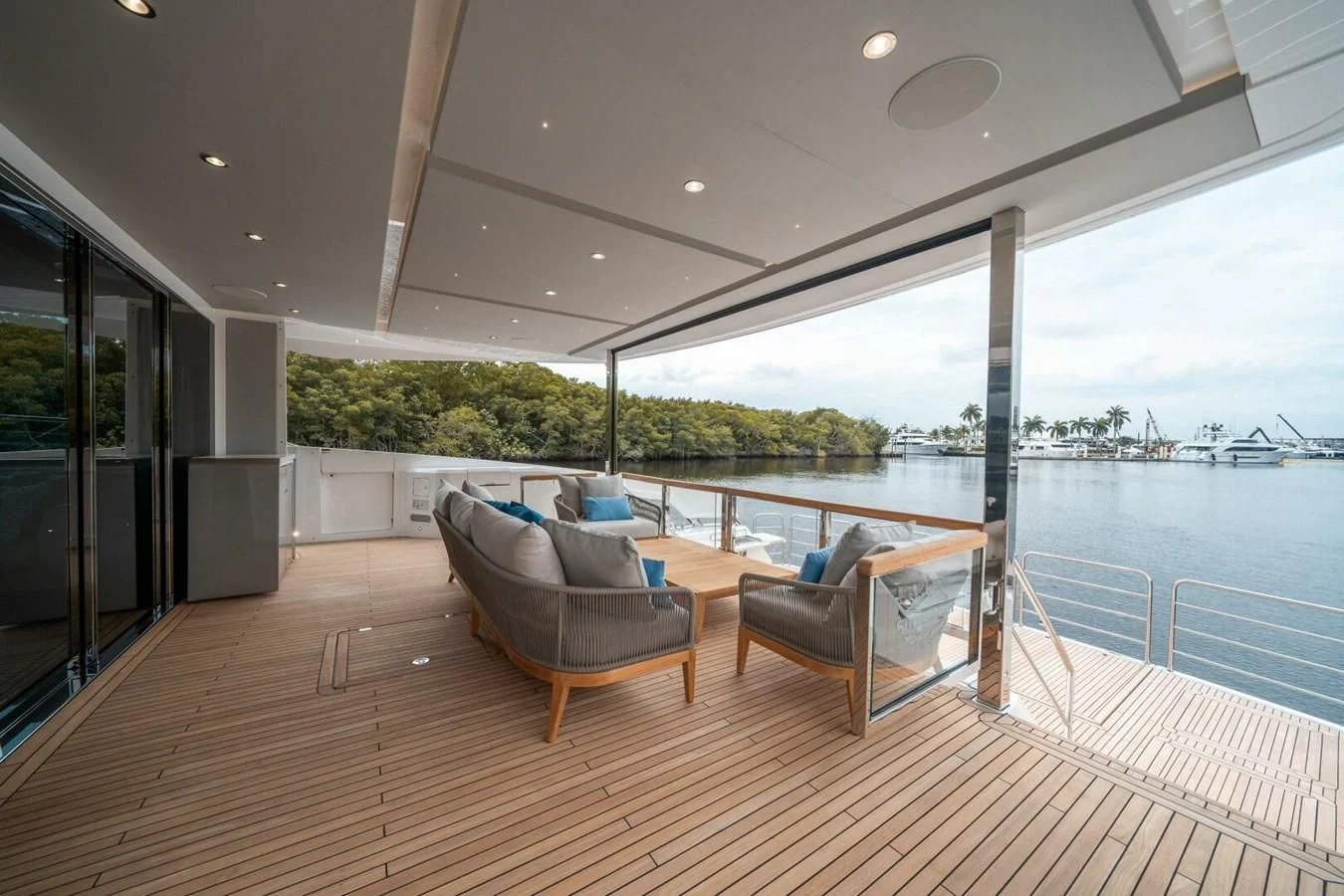 a large living room with a large deck and a large body of water aboard 90 OCEAN Yacht for Sale
