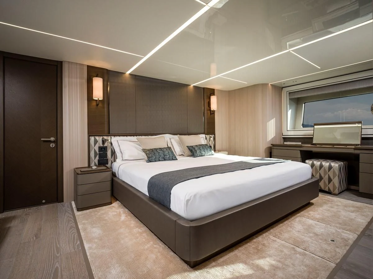 a large bedroom with a bed aboard 90 OCEAN Yacht for Sale