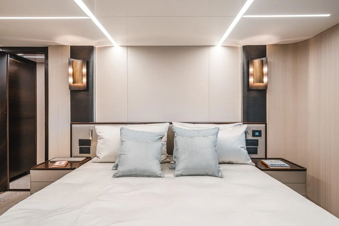 a bed with pillows aboard 90 OCEAN Yacht for Sale
