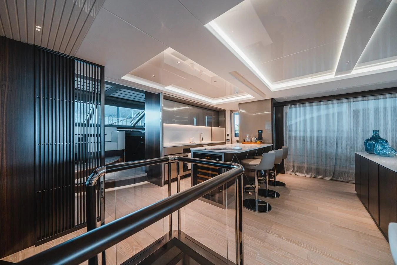 a modern kitchen with glass walls aboard 90 OCEAN Yacht for Sale