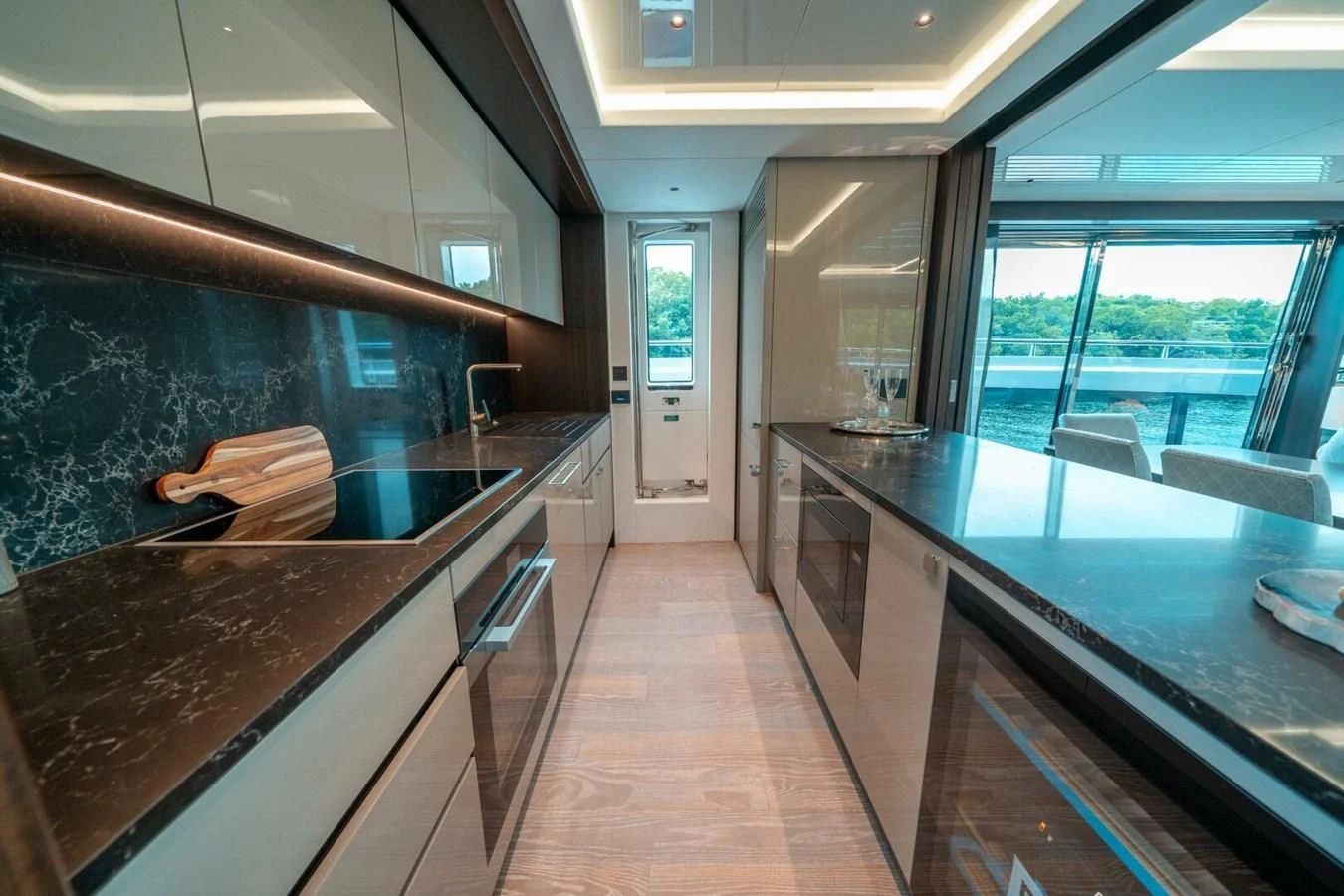 a kitchen with a large island aboard 90 OCEAN Yacht for Sale