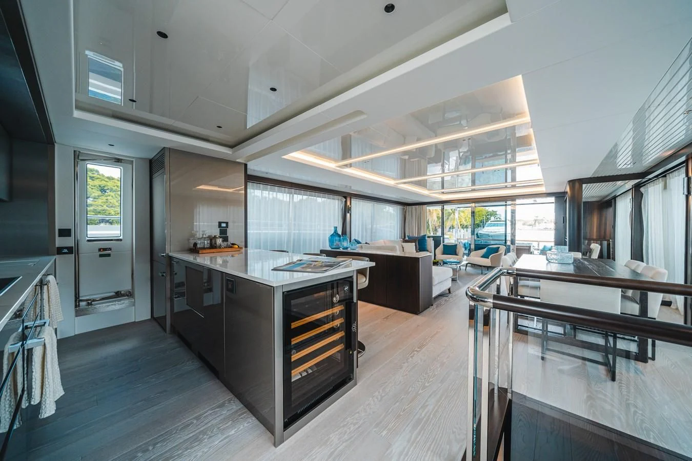 a large kitchen with a large island aboard 90 OCEAN Yacht for Sale