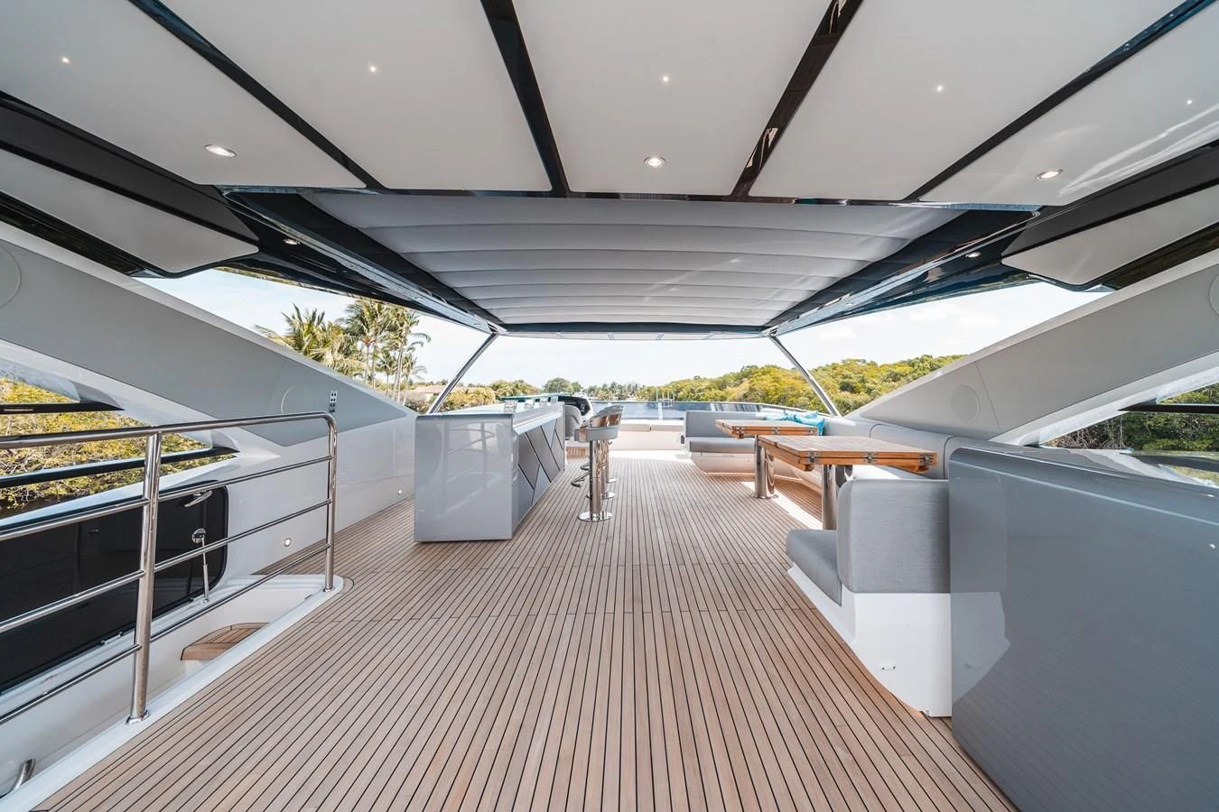 a long white room with a covered patio and a large white awning aboard 90 OCEAN Yacht for Sale