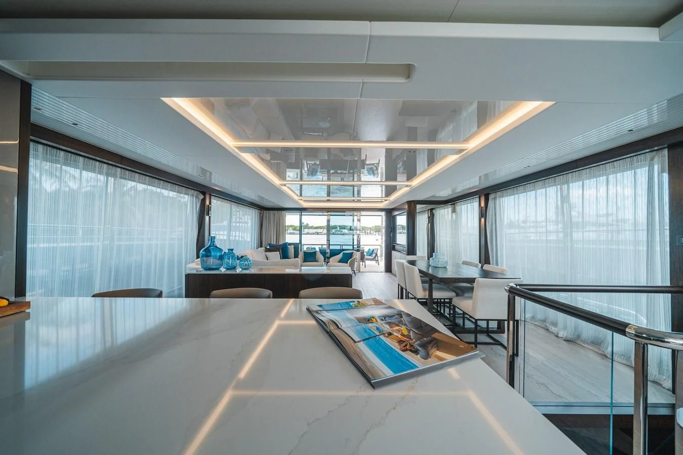 a room with a table and chairs aboard 90 OCEAN Yacht for Sale