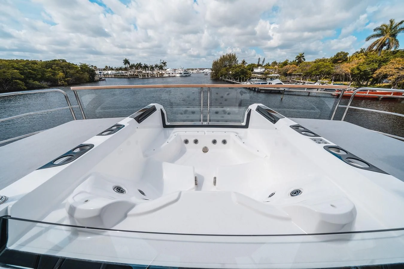a white boat on a deck aboard 90 OCEAN Yacht for Sale