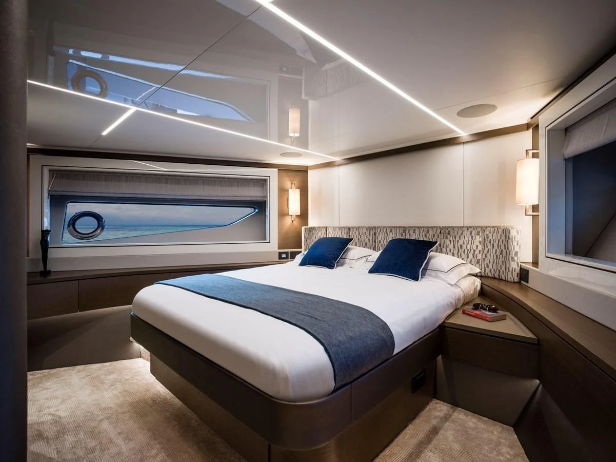 a room with a bed and a window aboard 90 OCEAN Yacht for Sale