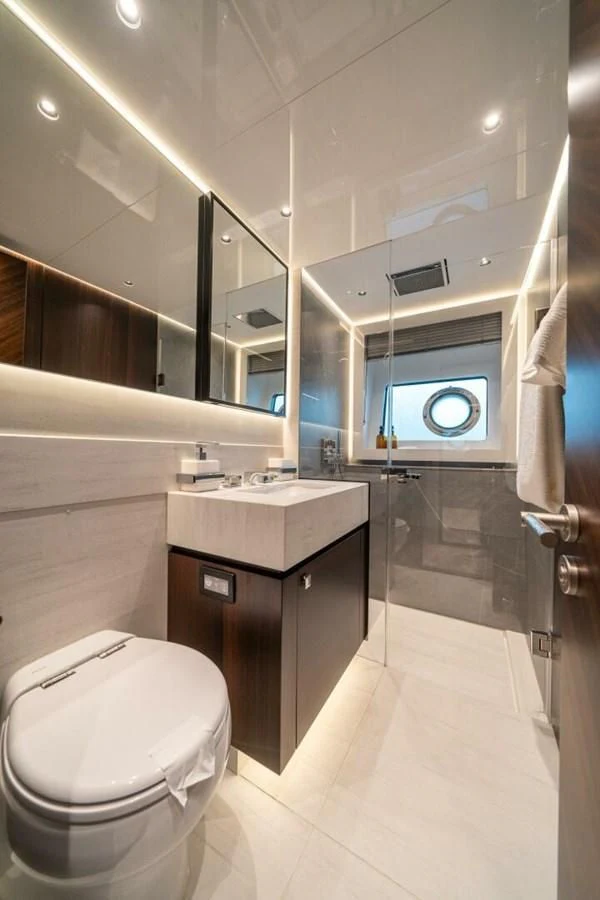 a bathroom with a toilet and a sink aboard 90 OCEAN Yacht for Sale