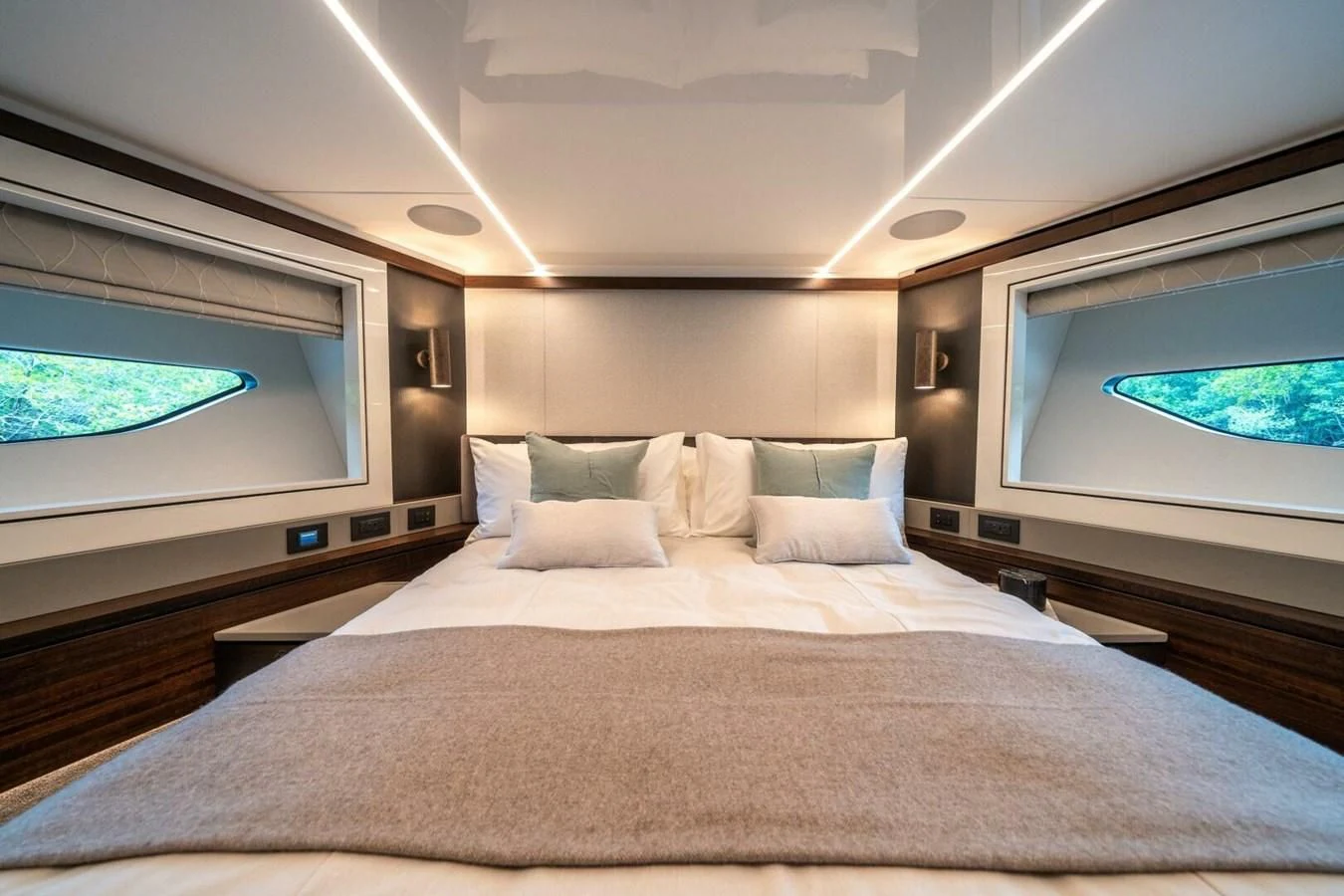 a bed with a television on the wall aboard 90 OCEAN Yacht for Sale