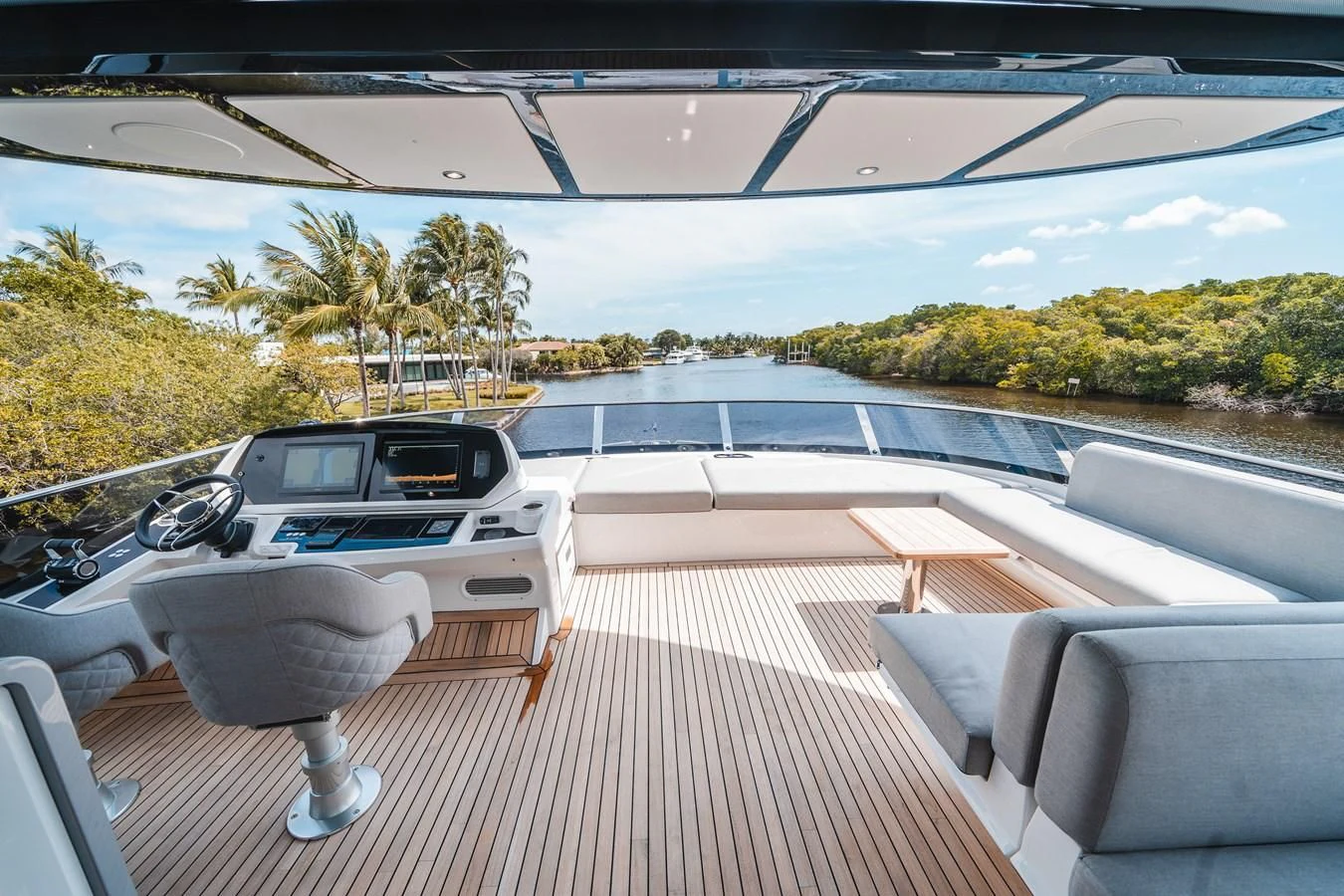 a deck with a couple of cars parked on it aboard 90 OCEAN Yacht for Sale