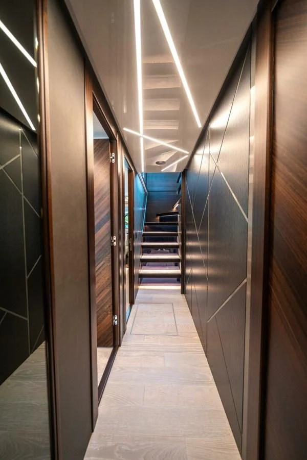 a long hallway with several doors aboard 90 OCEAN Yacht for Sale