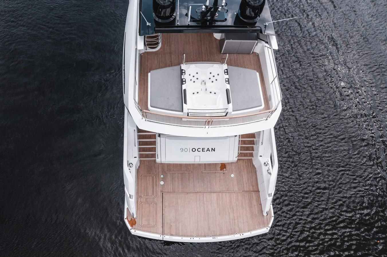 a white car in a box aboard 90 OCEAN Yacht for Sale