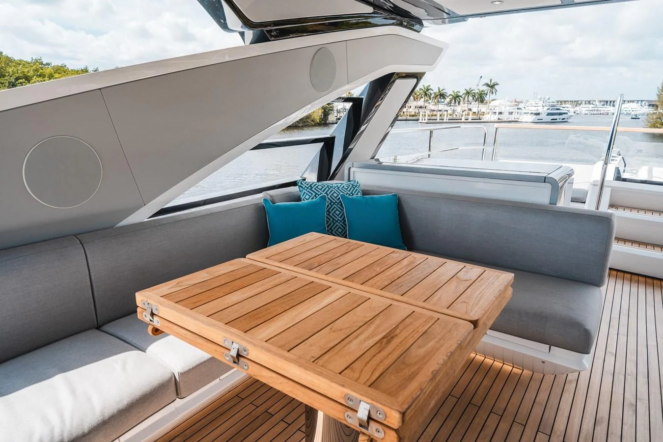 a deck with a table and chairs on it aboard 90 OCEAN Yacht for Sale