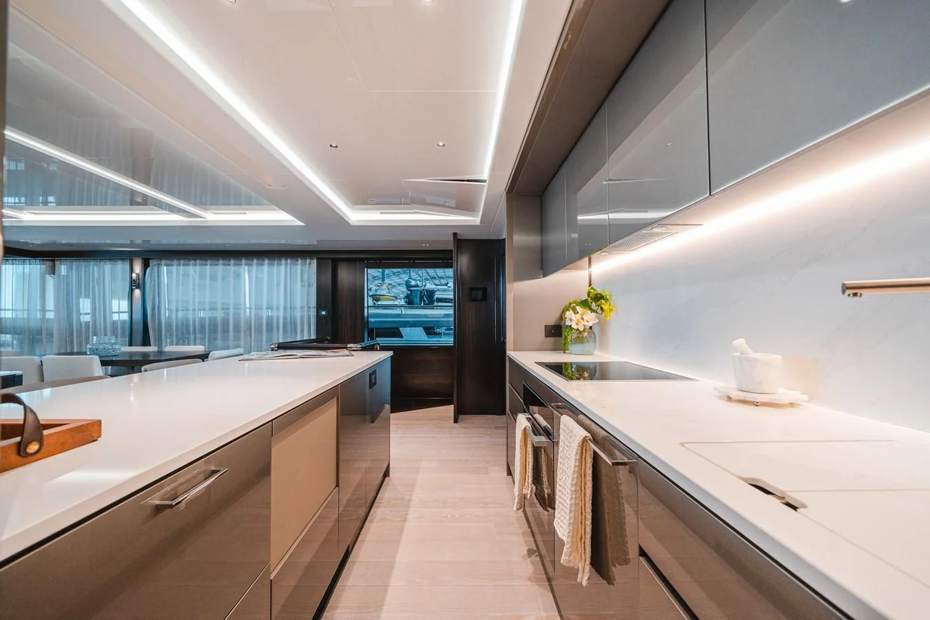 a kitchen with white cabinets aboard 90 OCEAN Yacht for Sale