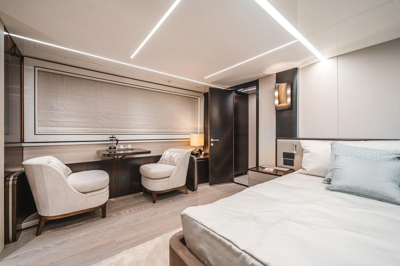 a modern bedroom with a bed and desk aboard 90 OCEAN Yacht for Sale