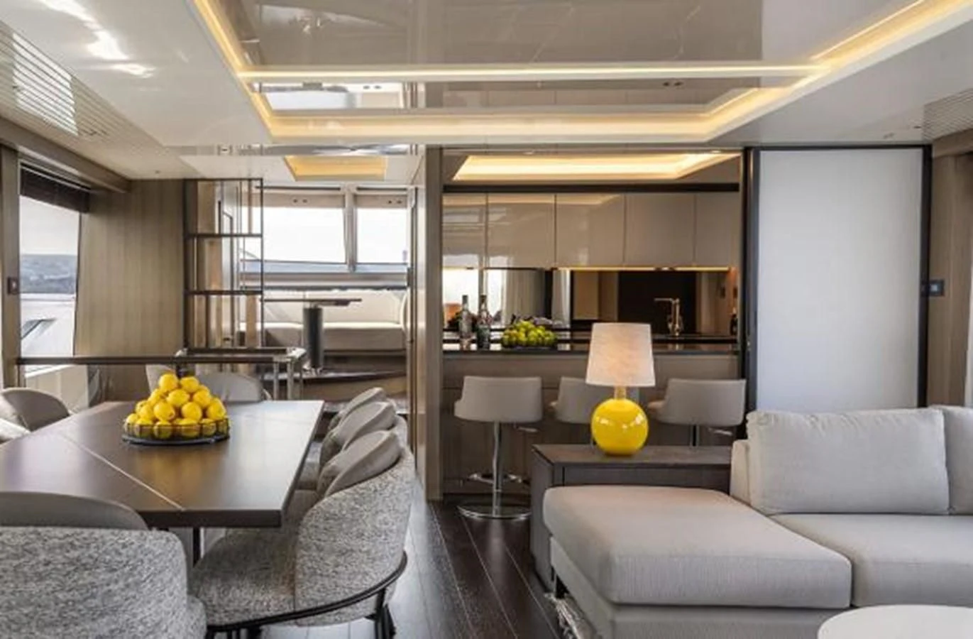 a living room with a table and chairs aboard 90 OCEAN Yacht for Sale