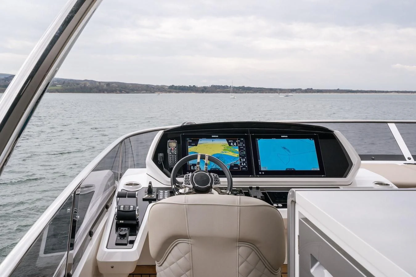 a car with a steering wheel on a boat aboard 90 OCEAN Yacht for Sale