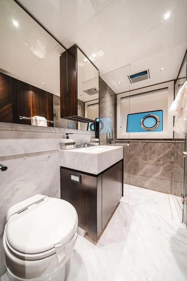 a bathroom with a toilet and sink aboard 90 OCEAN Yacht for Sale
