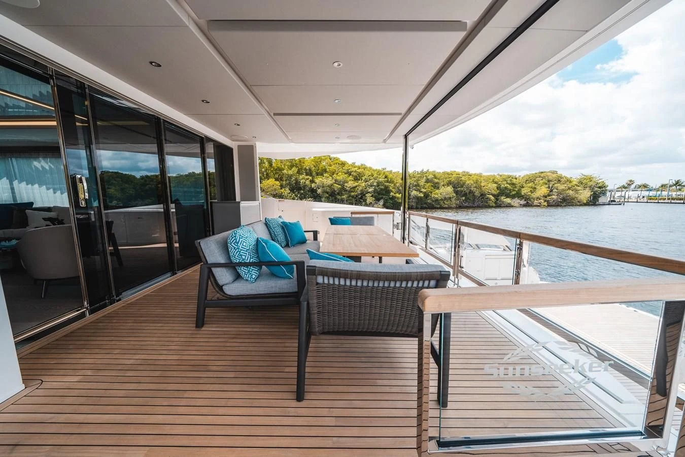 a deck with a view of a lake and a deck aboard 90 OCEAN Yacht for Sale