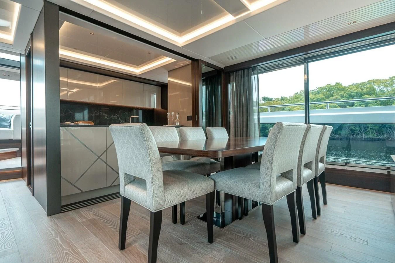 a room with a table and chairs aboard 90 OCEAN Yacht for Sale