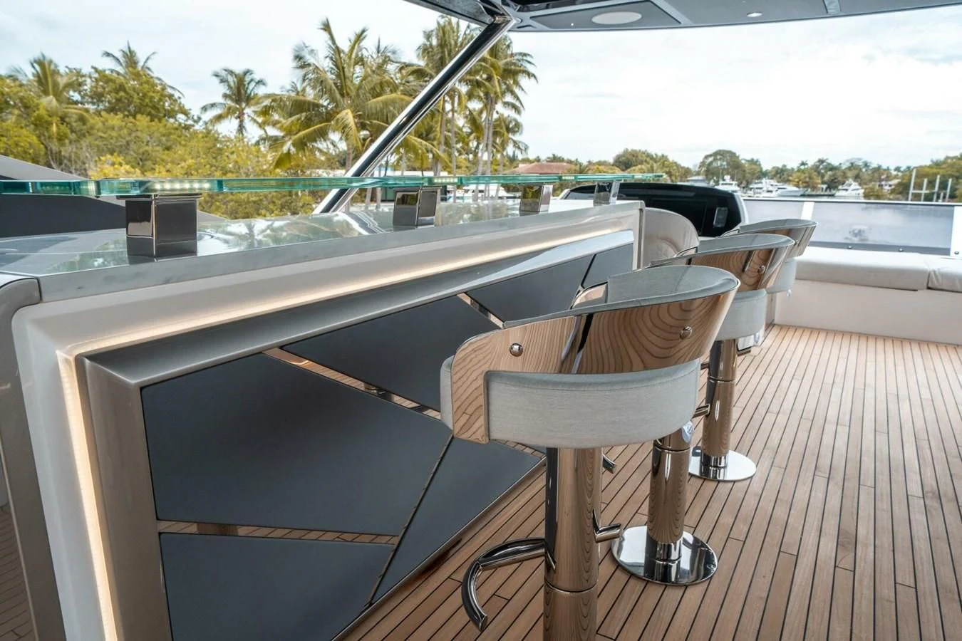 a table and chairs on a deck aboard 90 OCEAN Yacht for Sale