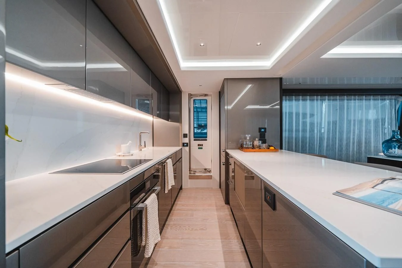 a kitchen with a large island aboard 90 OCEAN Yacht for Sale
