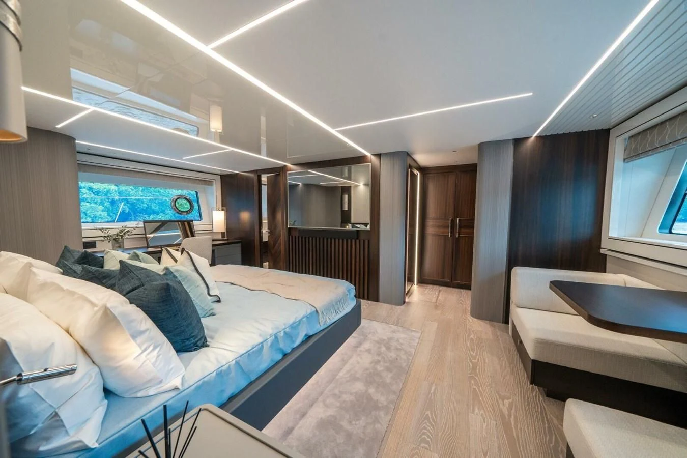 a room with a bed and a large window aboard 90 OCEAN Yacht for Sale