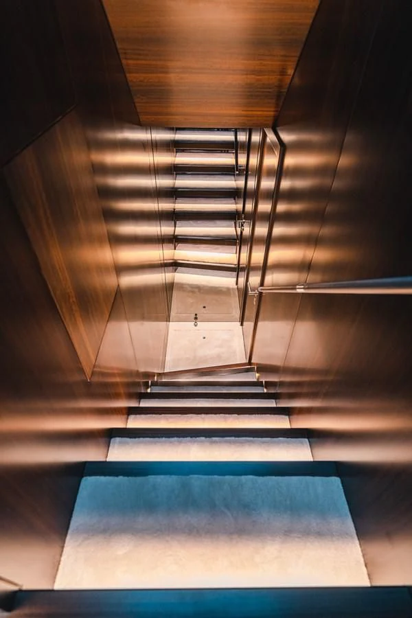 a staircase with a blue floor aboard 90 OCEAN Yacht for Sale