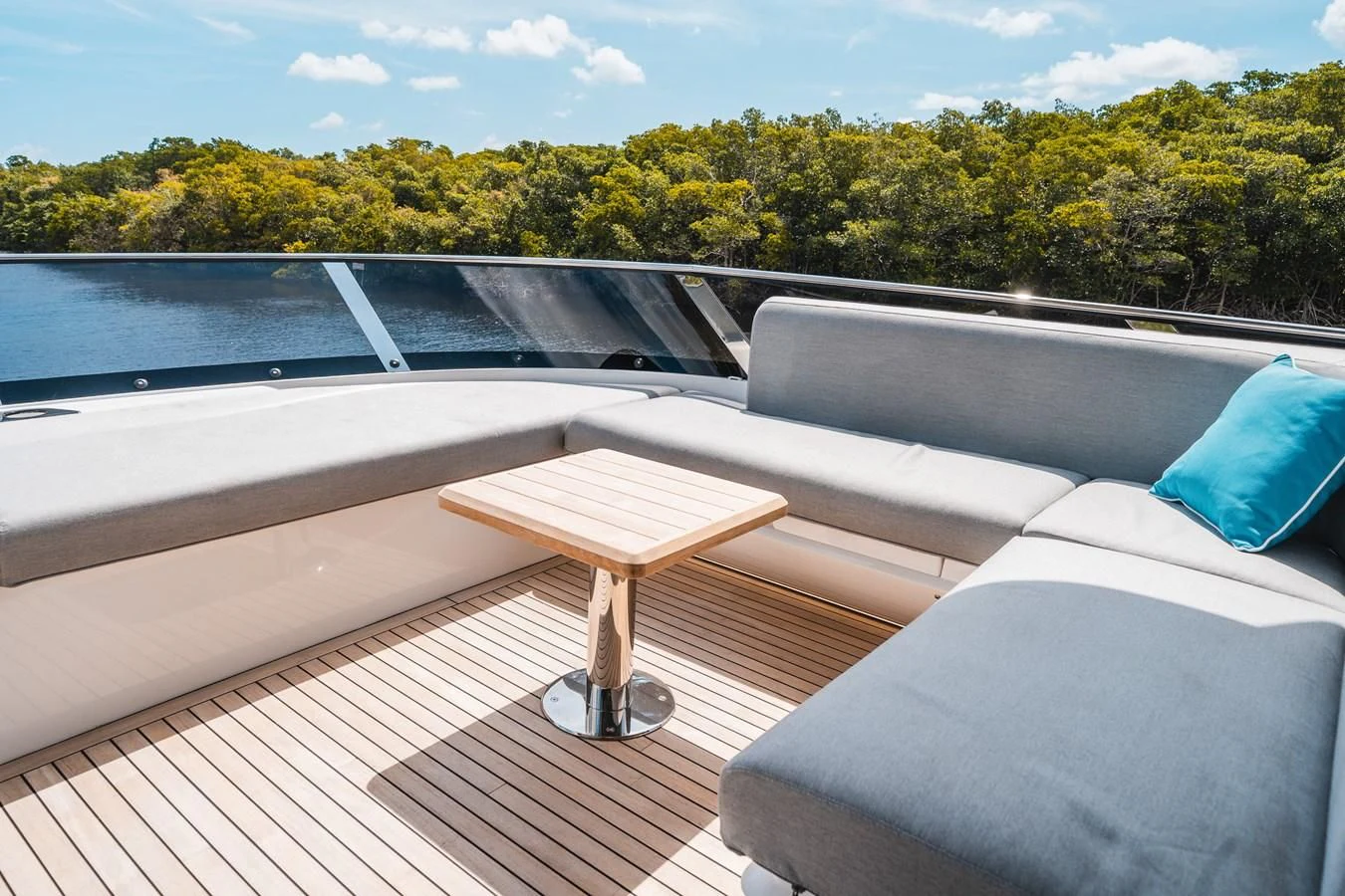a deck with a table and a pool aboard 90 OCEAN Yacht for Sale