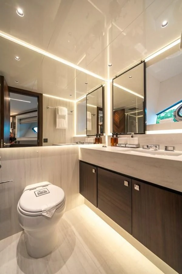 a bathroom with a toilet and a sink aboard 90 OCEAN Yacht for Sale