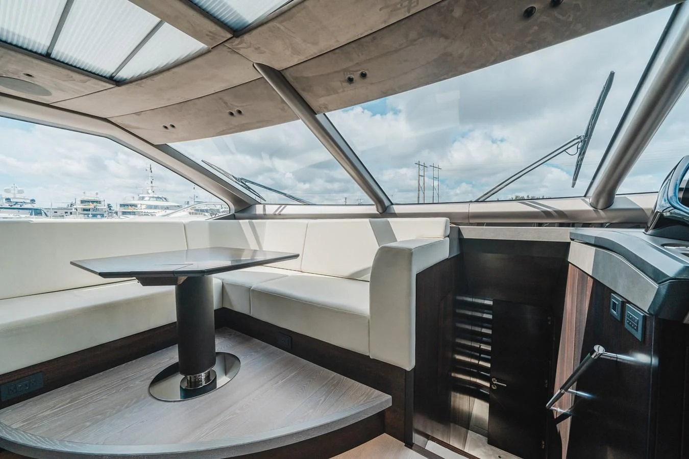 a room with a table and chairs aboard 90 OCEAN Yacht for Sale