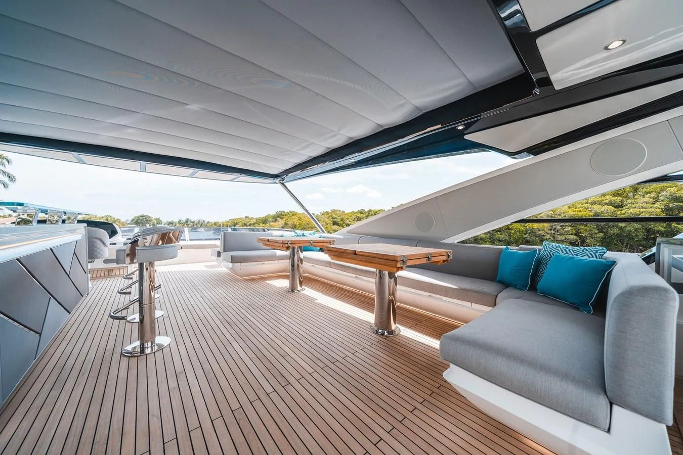 a deck with a couch and a table on it aboard 90 OCEAN Yacht for Sale